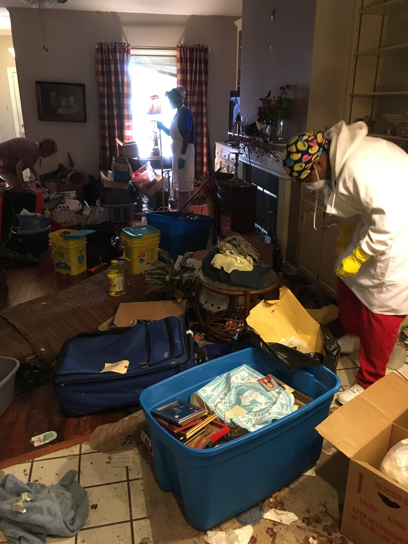 A hoarders living room that is junky
